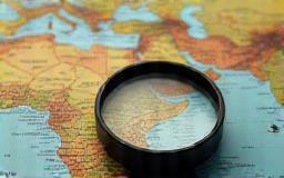 Magnifying glass over a map of India symbolizing local expertise